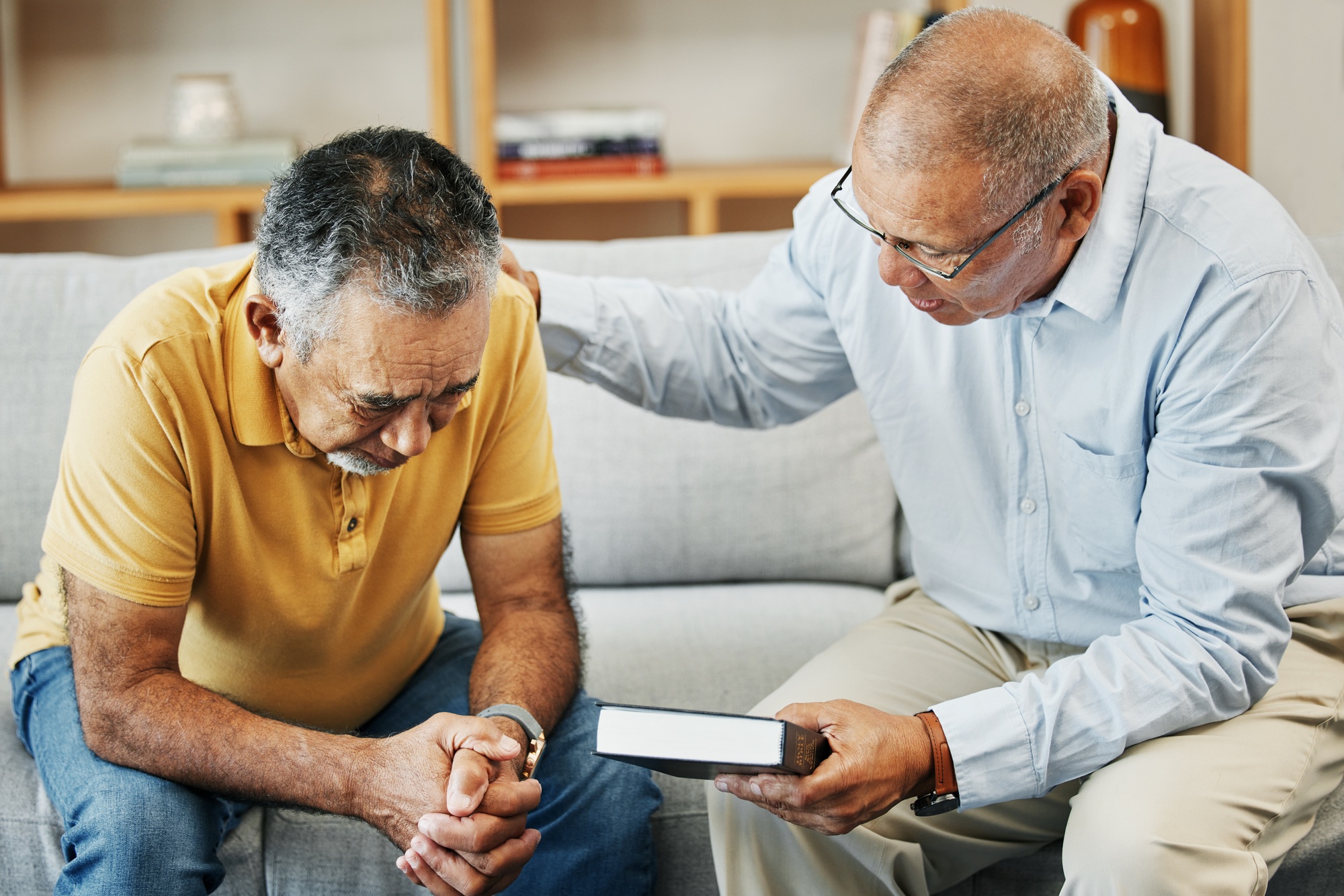 Men, home and bible with prayer for faith, jesus and worship, pastor and church with counselling. E